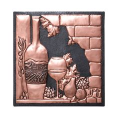 a metal plaque with wine and grapes on it