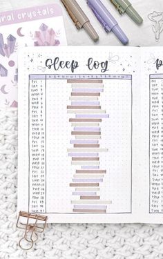 an open planner with the words sleep log written on it and some pens next to it