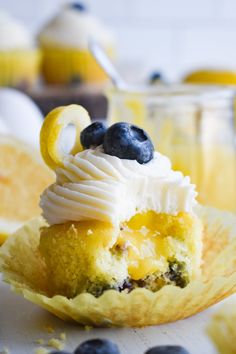 a lemon blueberry cupcake with whipped cream on top