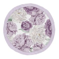 a paper plate with purple and white flowers on the front, in a circular pattern