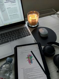 an open laptop computer sitting on top of a desk