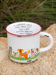 a coffee cup with an animal print on it sitting on top of a stone wall