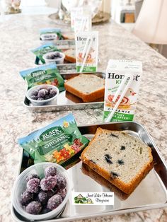 three trays filled with food sitting on top of a counter