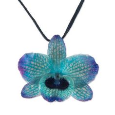 Local Thai artisans carefully select a natural orchid flower ensuring its quality. The beautiful flower is preserved through a painstaking electroplating process which coats it in shining resin to display its dyed midnight hues. Adorning the neck on a length of leather cord this pendant necklace features an adjustable length with sliding glass beads at the clasp. Orchid Necklace, Nature Necklace, Orchid Flower, Nature Jewelry, Artisan Craft, Jewelry Packaging, Gorgeous Necklaces, Beautiful Flower, Natural Beads