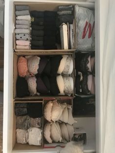 an organized closet with clothes and slippers on the shelf next to bedding sheets