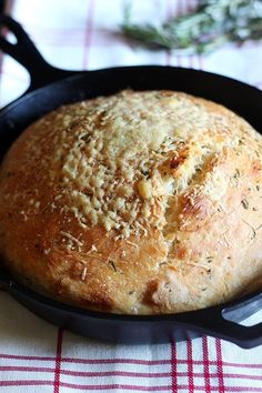 a loaf of bread in a cast iron skillet