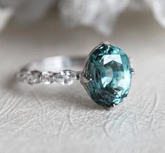 Large Oval Sapphire Engagement ring White Gold | Capucinne Jewelry Blue Green Sapphire Ring, Paris Ring, Teal Sapphire Engagement Ring, Oval Sapphire Engagement Ring, Sapphire Diamond Engagement Ring, Engagement Ring Blue, Blue Sapphire Diamond Ring, Diamond Sapphire Engagement Ring, Sapphire Diamond Engagement