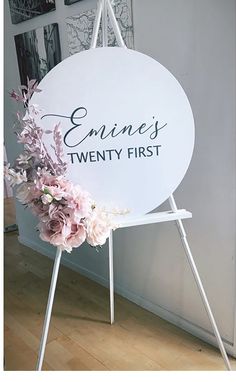 a white sign with flowers on it that says, emmett's twenty - first