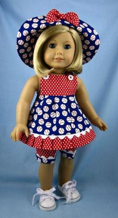 a doll is wearing a dress and hat