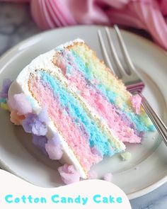 a piece of cake on a plate with a fork next to it and the caption cotton candy cake