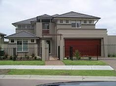 the exterior of a two story house with grey paint