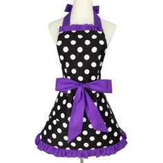 a black and white polka dot apron with purple ribbon