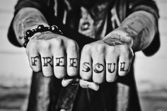 two hands with the word free soul written on them, both holding their fingers together