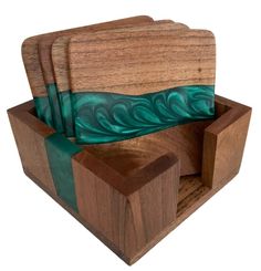 wooden cutting board and knife holder with green satin ribbon on it's edges, set against a white background