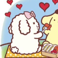 a dog is eating out of a box with hearts on the side and another dog has its nose open