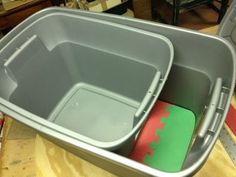 two plastic containers are sitting on a table