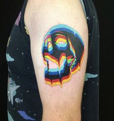 a man with a colorful tattoo on his arm