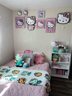 a bedroom with hello kitty pictures on the wall