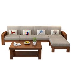 a couch and coffee table with pillows on it in front of a white background,