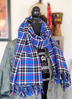 The dark blue Maasai shuka/throw is a warm, vibrant and versatile fabric made in Kenya by members of the East African Maasai tribe known for being fierce warriors. You'll walk with pride and style when wearing it as a wrap around the shoulders, neck or how much it would jazz up your chair or sofa. The Shuka, is a traditional Maasai tribe garment made of thick cotton and acrylic that is worn in a variety of ways from hunting to during ceremonies. Size 40” W x 71”L Cotton and acrylic Care: wash on Maasai Shuka, Maasai, The East, Wrap Around, Plaid Scarf, Shawl, Blue Black, Hunting, Dark Blue