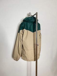 1980s 80s 1990s 90s Sunbuster Windbreaker Nylon Beige Forest Green Colorblock Colorblocked Pullover Athletic Casual Spring Jacket Size Large LFeatures:-Beige and forest green color block-Nylon water repellant fabric-Pullover closure-Large front pocket on the front-Drawstring waist -Hooded-Label: SunbusterCondition: Good-A couple of small marks on the corner of the chest, pictured. Barely noticeable Measurements:Bust: 44”Waist: 41”Hips: 42”Length: 27”Sleeves: 24”ZB Green Long Sleeve 90s Windbreaker, Retro Nylon Windbreaker With Pockets, Vintage Winter Color Block Windbreaker, 90s Patchwork Windbreaker For Outdoor, Colorblock Windbreaker, Red Windbreaker, Vintage Multicolor Windbreaker With Pockets, Spring Jacket, Forest Green Color