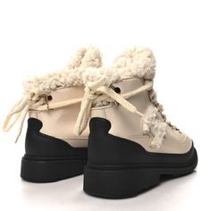 This is an authentic pair of CHANEL Calfskin Shearling CC Lace Up Boots size 38 in Light Beige and Ivory. These stylish, lace-up boots are crafted of calfskin leather, a black rubber heel, wool uppers and a 1.25 inch rubberized sole. Rubber Heels, Black Rubber, Light Beige, Lace Up Boots, Calf Skin, Chanel, Lace Up, Thing 1, Wool