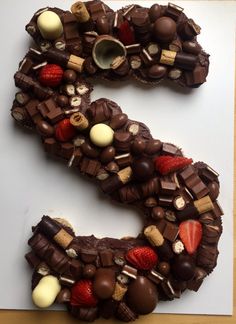 the letter s is made up of chocolate and strawberries