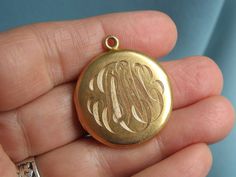 Features is this lovely solid 14k yellow gold engraved locket by Strobell & Crane.  It is in very good preowned condition and measures approx. 1 1/4" tall x 1 1/16" wide.  It is marked on the inside edge: S14C.  The locket has been assay tested at solid 14k gold.  The locket has a nice, firm snap closure.  Total weight is 6.8 grams. High quality fine jewelry locket.  Strobell & Crane were manufacturers of fine jewelry in Newark, NJ and were listed as early as 1909, and were incorporated in 1922. **All of my listings are vintage, which means they will naturally show some signs of wear. All jewelry measurements are listed in the description. And the majority of jewelry is photographed by a ruler. All of which is to best inform the buyer of the exact size of the jewelry item. Please make sure Antique Gold Jewelry With Initials, Victorian 14k Gold Stamped Locket Necklace, Victorian Engraved 14k Gold Locket Necklace, Victorian Gold Jewelry With Initials, Victorian 14k Gold Initials Jewelry, Victorian 14k Gold Jewelry With Initials, Victorian 14k Gold Locket Necklace Gift, Victorian Gold Personalized Jewelry, Gold Medallion Locket Necklace With Engraving Option