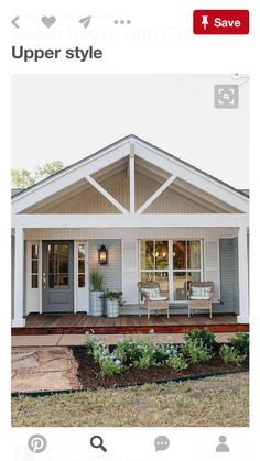 a small white house with an open front porch