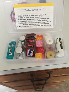 the teacher survival kit is organized in a plastic container on top of a countertop