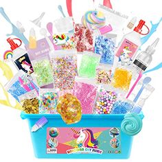 a blue bucket filled with lots of different types of candy and confection items