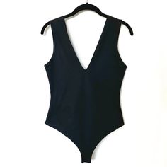 Pre-Loved. Unworn In Great Condition. Size M Self: 88% Nylon, 12% Spandex Lining: 92% Poly, 8% Spandex Mesh Lining Elasticized Trim Bottom Snap Button Closure Stretch V-neck Bodysuit For Workout, Black Stretch One-piece Top, V-neck Stretch Bodysuit For Workout, Black Second-skin Bodysuit For Workout, Black High-stretch Bodysuit For Spring, Black Elastane Bodysuit For Night Out, Stretch Bodysuit For Workwear In Summer, Black Stretch Bodysuit With Seamless Construction, Chic Black Elastane Swimwear