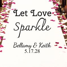 a wedding aisle with petals on it and the words let love brew written in black