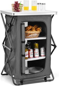 an outdoor cooler with food and drinks on it's side, in front of a white background