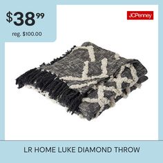 a black and white diamond throw with the price $ 38 99 reg $ 100 00