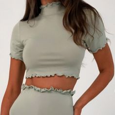 Missguided Coord Ss Crop Top Lettuce Hem ~Color Sage ~Size 8 ~Sage Jersey Short Sleeve Crop Top With A High Neck And Lettuce Hem Finish ~Regular Fit Crop - Sits At The Waist ~96% Polyester 4% Elastane *Feel Free To Request Pictures Of Actual Item *Item Is Sealed And Brand New Fitted Short Sleeve Solid Color Crop Top, Spring Solid Color Short Sleeve Crop Top, Spring Short Sleeve Solid Color Crop Top, Fitted Green Solid Color Crop Top, Fitted Solid Color Crop Top For Spring, Stretch Crop Top With Ruffles And Short Sleeves, Stretch Ruffle Crop Top With Short Sleeves, Green Solid Color Crop Top For Spring, Spring Green Solid Crop Top