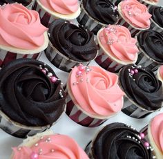 cupcakes decorated with pink and black frosting