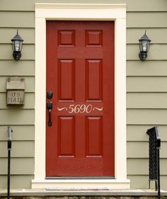 a red door with welcome written on it