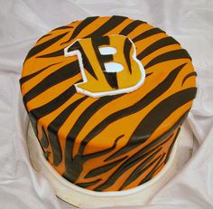 a tiger print cake with the letter f on it