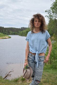 "Excellent denim blouse for your midsummer nights. It is not a mistake - buttons are on the back! Size: label says S, seems like women's (S) MEASUREMENTS: Length: 57 cm/ 22\" (without ties) Shoulder to shoulder: 50 cm/ 20\" Chest: 116 cm/ 46\" Condition: excellent Fabric: Lyocell Brand: unknown * Wash at temperature not higher than 30oC / 86oF Model wears: UK 8/ EU 36/ US 4 Model's height: 175 cm/5'7\" You can find more similar shirts here: https://www.etsy.com/shop/OnTheRoadStore?section_id=239 Short Sleeve Denim Top For Summer, Summer Denim Blue Top With Short Sleeves, Light Indigo Short Sleeve Denim Top For Summer, Denim Beach Top With Short Sleeves, Beach Denim Short Sleeve Top, Indigo Denim Shirt For Summer, Light Wash Short Sleeve Denim Top For Summer, Summer Chambray Denim Shirt, Summer Indigo Denim Shirt