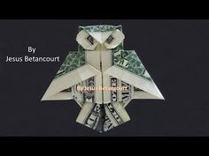 an origami owl made out of dollar bills