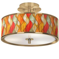 a semi flush light fixture with an orange, yellow and green shade on the drum