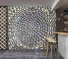 a room with a wall made out of rocks and wine bottles on the shelves next to it