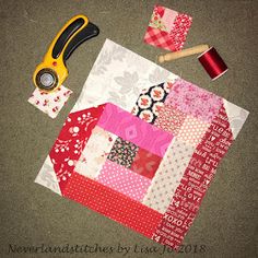 sewing supplies are laid out on the floor to make a quilted table runner or wall hanging