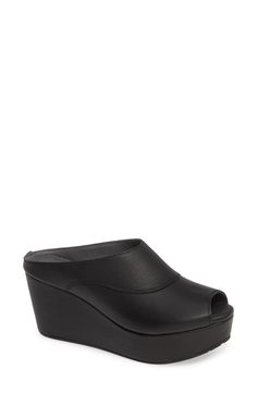 A wrapped wedge, chunky rocker platform and curvy seamed vamp underscore the '70s-inspired aesthetic of a decidedly modern peep-toe mule. 3" heel; 1 1/2" platform (size 8.5) Lightly cushioned footbed Leather or textile upper/leather lining/synthetic sole Imported Women's Shoes Modern Open Toe Mules With 4-inch Heel, Spring Mules With Chunky Platform And Wedge Heel, Closed Toe Synthetic Platform Slides, Modern Black Wedge Heel Mules, Modern Chunky Platform Slip-on Mules, Modern Closed Toe Platform Slippers For Spring, Modern Wedge Heel Mules With Padded Heel, Modern Wedge Sandals With Stacked Heel And Round Toe, Synthetic Open Toe Platform Mules