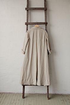 Long coat is made from 100% soft and washed medium weight linen. Details: - Composition: 100% Oeko-Tex certified linen - A shaped - Colour: natural - Linen belt - 3 linen buttons - Size: XS, S, M, L, XL, XXL - Medium weight linen - Linen care: machine wash gentle; tumble dry low, ironing optional - The price is for one coat, other pictured items are not included Beige Linen Outerwear For Daywear, Spring Linen Long Coat, Oversized Linen Outerwear For Daywear, Oversized Beige Linen Outerwear, Chic Linen Long Coat, Relaxed Fit Long Linen Outerwear, Oversized Linen Long Coat, Single-breasted Long Linen Coat, Brown Single-breasted Linen Outerwear