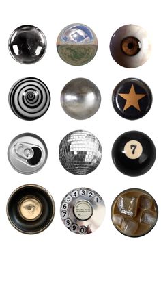 several different types of buttons and knobs on a white background