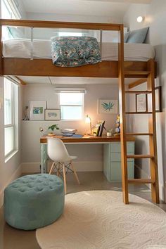 a loft bed with a desk underneath it and a ladder to the upper level above