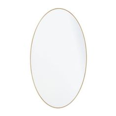 an oval mirror on a white wall