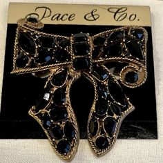 Pace & Company Started Making Jewelry In Greenville, South Carolina In 1948. This Heavy Black Rhinestone Encrusted Bow Brooch Is Truly A Work Of Art. The Gold Tone, Metal Hardware Is Exquisitely Designed To Frame A Detailed “Bow”Using A Rope, Swirling Cable Outline Encircling The Multi Dimensions Of The Bow. 33 Total Stones, Including Emerald, Round, Marquis Cuts In Various Sizes Make Up The Brooch. Measurements Are 3” Width By 2 1/2” Height. The Round Brooch Pin Clasp Has A Sturdy Loop For A Ch Chic Black Brooches For Parties, Chic Black Party Brooches, Black Brooch Jewelry For Party, Black Party Jewelry Brooch, Chic Black Brooch As A Gift, Chic Black Brooch For Gift, Chic Black Brooches For Gifts, Greenville South Carolina, Bow Brooch